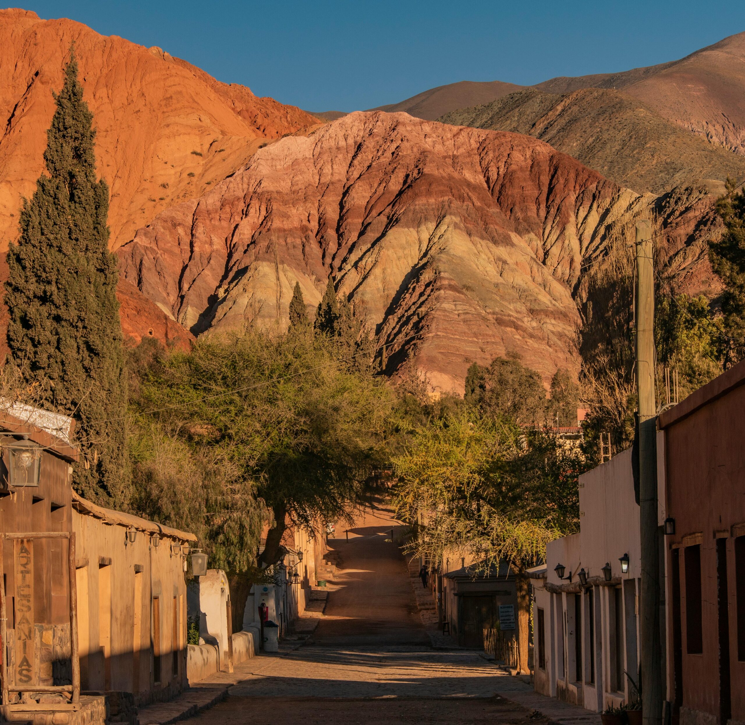 View of the vibrant mountains and quaint street in Purmamarca, Jujuy, Argentina.